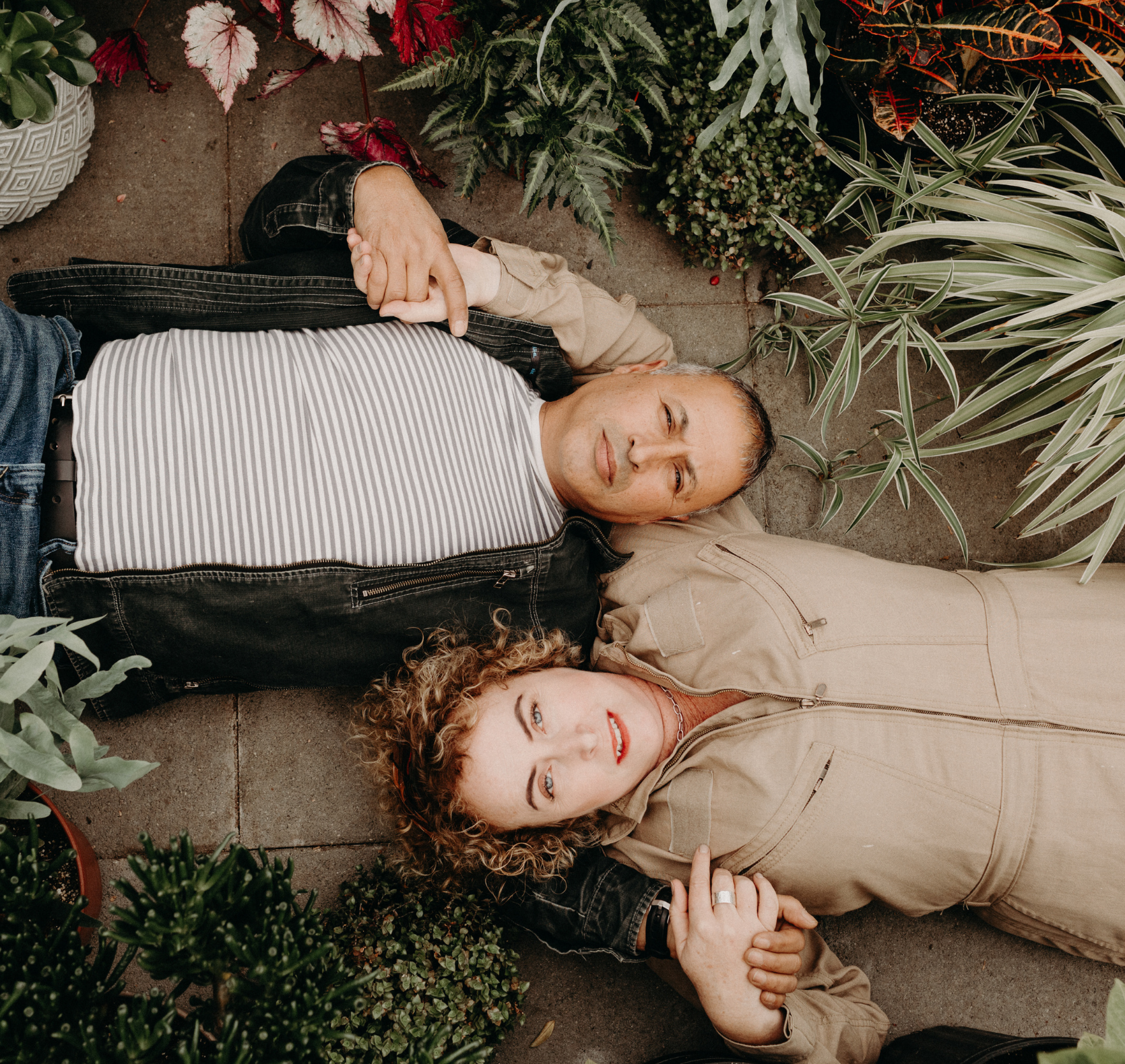 Kelly and Eko, the owners of Down to Earth Landscaping, sitting in the nursery